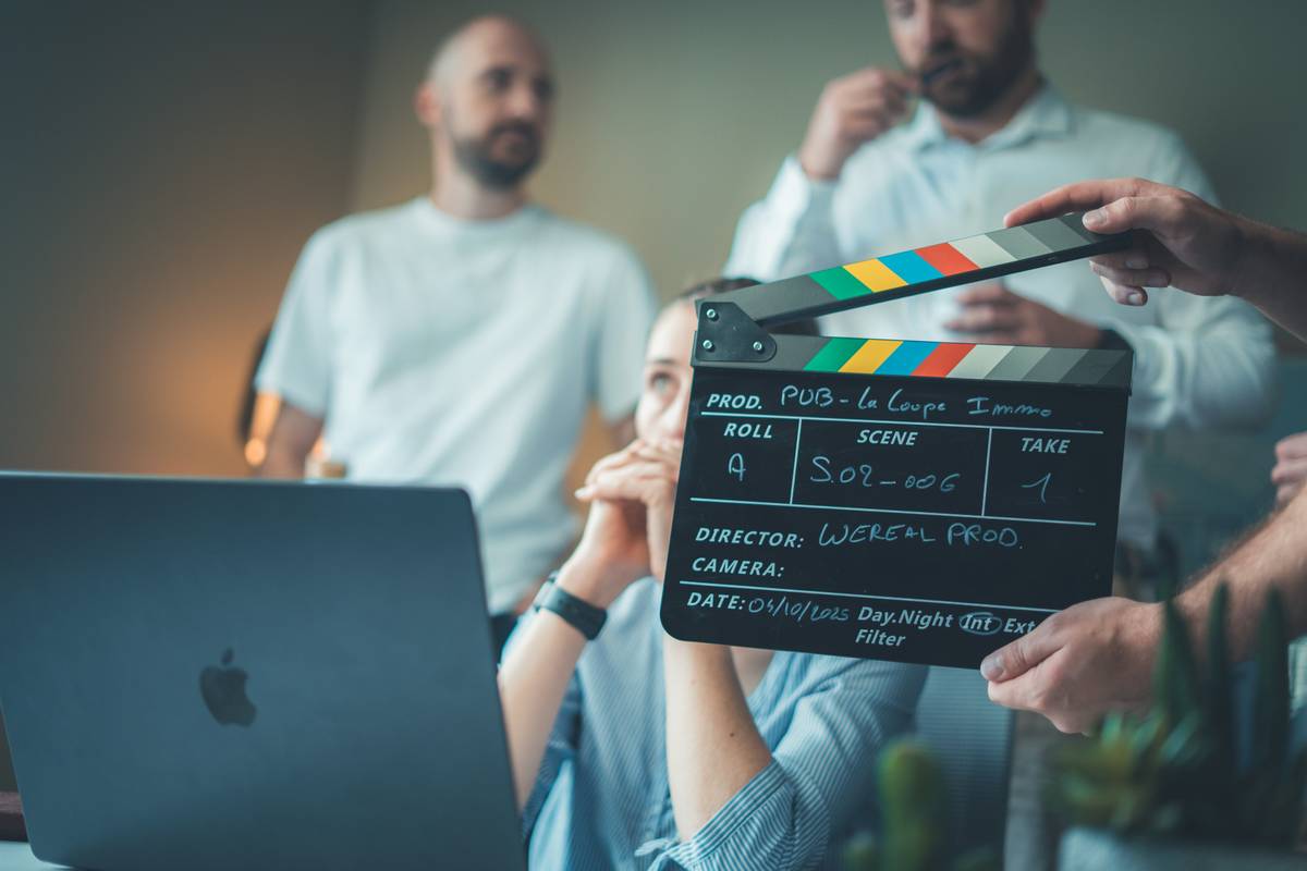 indie filmmaker reviewing film production insurance cost documents on set